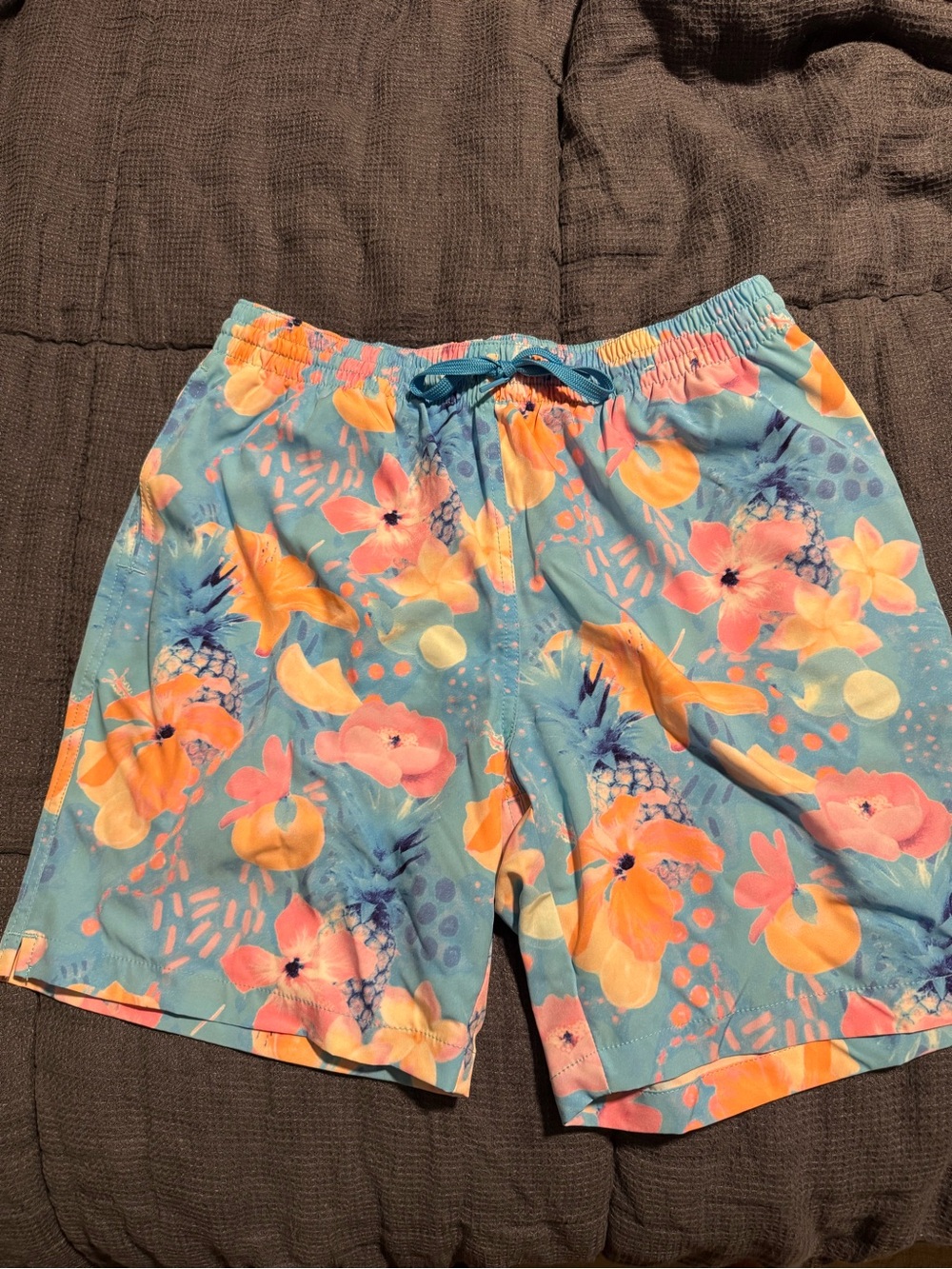 chubbies Blue Tropical Floral Swim Shorts with Coral Accents